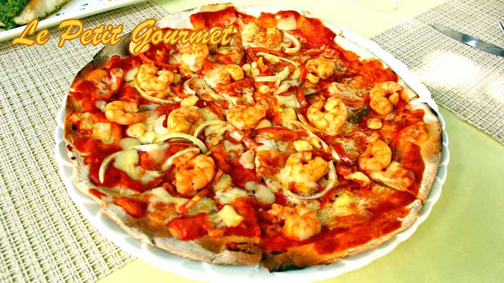 Grand choix de pizza cuite au feu de bois Livraison à domicile pizza et plats - Tél. +221 77 145 00 70 / +221 77 376 36 54